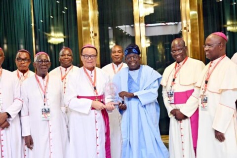 President Tinubu flanks by members of the Catholic Bishops Conference of Nigeria CBCN on Friday March 14 696x464