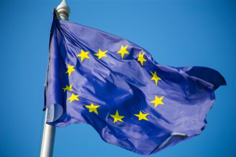 european union flag fluttering against blue sky 2048x1365 1 1024x683
