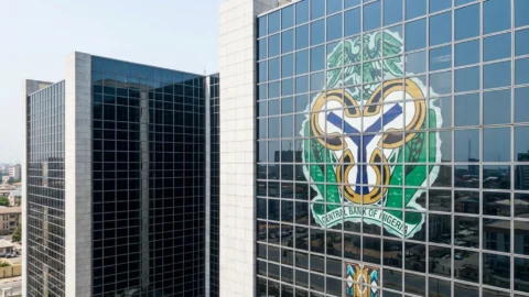 Central Bank of Nigerias logo is seen on the headquarters building in Abuja